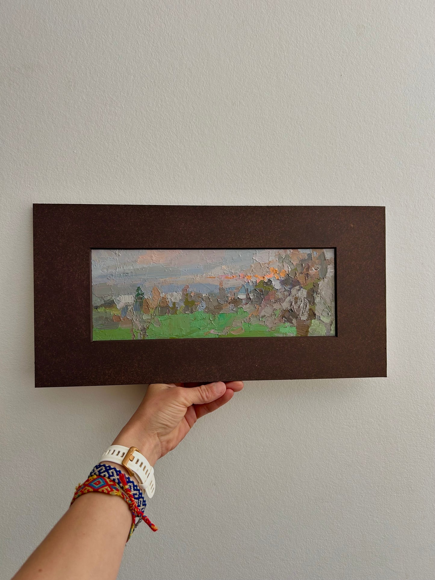 A tree with gray branches in the sunset fields. December. 10.5x28cm